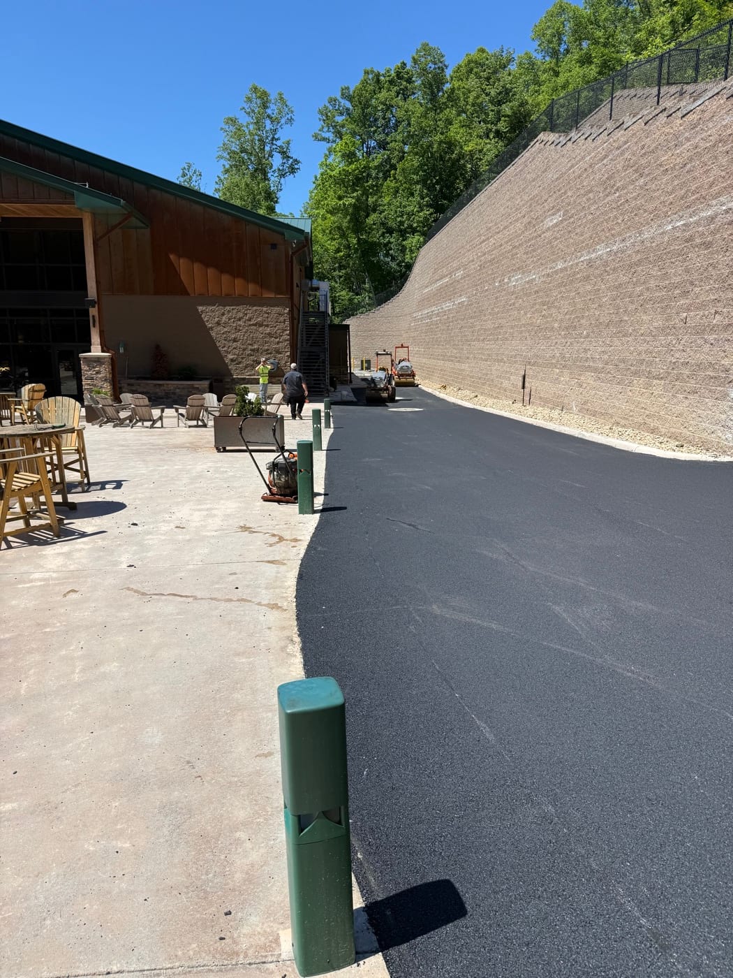 Finished blacktop along the retaining wall near Thomas Road Outpost